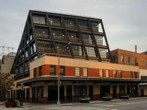 Modern building with a unique geometric roof design.